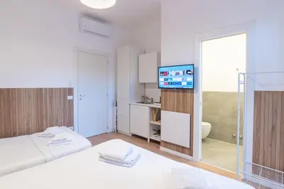 a hotel room with a bed and a television at Residence San Paolo in Rome