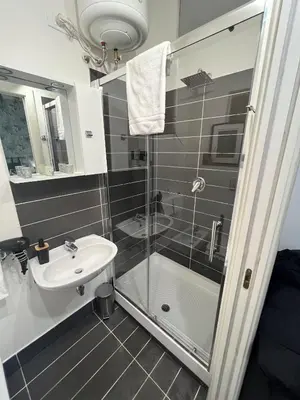 a bathroom with a shower and a sink at L’oasi di Trastevere in Rome