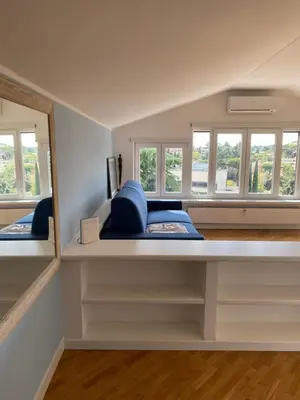 a room with two windows and a bed at Piccolomini Design Apartment in Rome