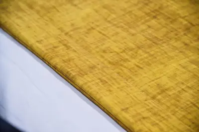 a close up view of a yellow cutting board at Alba Rosa Rooms in Rome