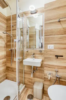 a bathroom with a sink and a shower at Easybnb - Domus Orbitelli in Rome