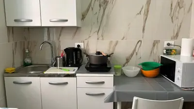 a kitchen with a sink and a counter top at Guesthouse Dahlia Rossa in Rome