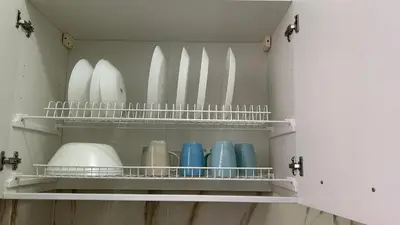a row of surfboards and bowls on shelves in a room at Guesthouse Dahlia Rossa in Rome