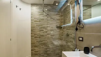 a bathroom with a shower and a sink at Ripetta Boutique Suites in Rome