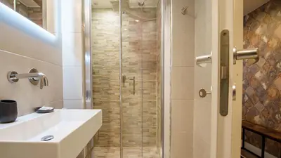 a bathroom with a shower and a sink at Ripetta Boutique Suites in Rome