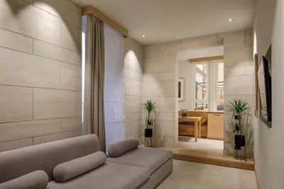 a living room with a couch and a table at Ripetta Luxury Apartments in Rome