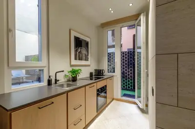 a kitchen with a sink and a window at Ripetta Luxury Apartments in Rome