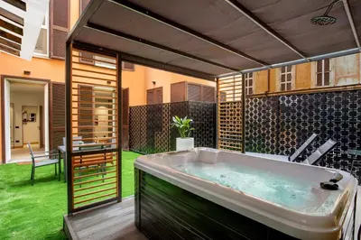 a large bath tub in a yard with a patio at Ripetta Luxury Apartments in Rome