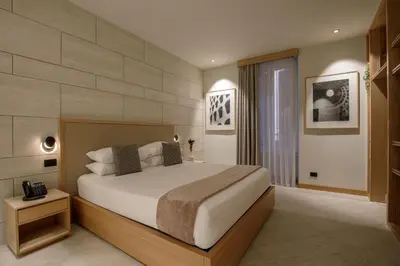 a bedroom with a large bed in a room at Ripetta Luxury Apartments in Rome