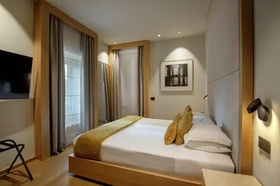 a bedroom with a large bed in a room at Ripetta Luxury Apartments in Rome