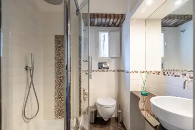 a bathroom with a shower and a toilet and a sink at Piazza del Popolo Home 2 camere in Rome