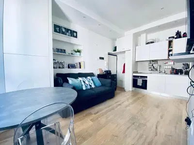 a living room with a couch and a table at Casa Aventino in Rome