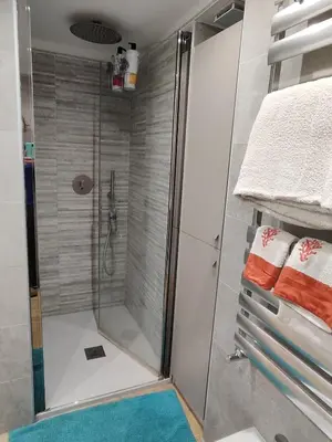 a shower with a glass door in a bathroom at Casa Aventino in Rome