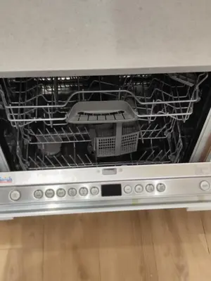 an empty dishwasher with a tool inside of it at Casa Aventino in Rome