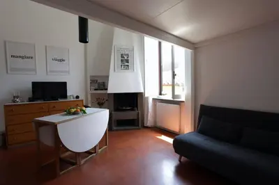 a living room with a couch and a table at Scarpetta32 - Your home in Trastevere in Rome