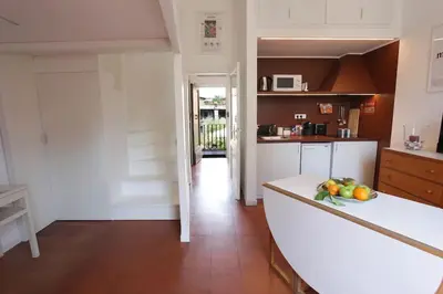 a kitchen with a counter with fruit on it at Scarpetta32 - Your home in Trastevere in Rome