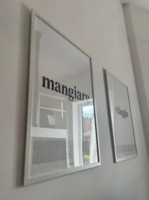 two mirrors on a wall in a room at Scarpetta32 - Your home in Trastevere in Rome