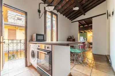 a kitchen with a washer and dryer on a counter at GuestHost - Cozy Trevi Romance in Rome