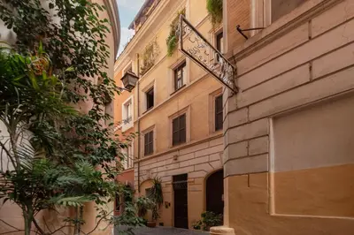 a street sign on the side of a building at GuestHost - Cozy Trevi Romance in Rome