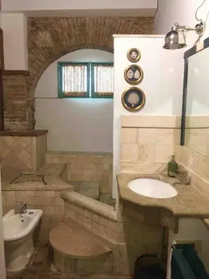 a bathroom with a sink and a toilet at Farnese Muse in Rome