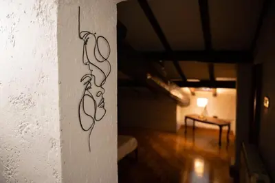 a drawing on the side of a wall in a room at Guest house Sempione da Giulio in Rome