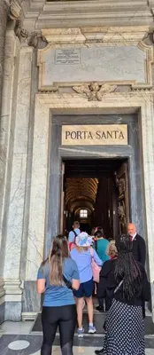 a group of people standing outside of a building at Domus romae esquilini in Rome