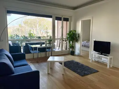 a living room with a couch and a tv at Moderno bilocale con terrazzo in Rome