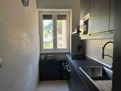 a kitchen with a sink and a window at Moderno bilocale con terrazzo in Rome