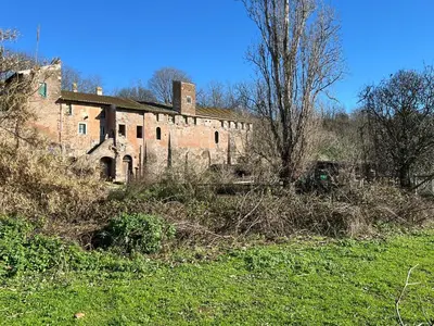a sign in a field next to a rock at Green House Exclusive Suite near Metro A in Rome