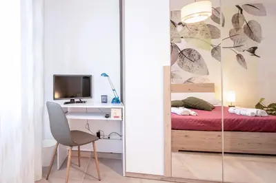a white bathroom with a sink and a toilet at Green House Exclusive Suite near Metro A in Rome