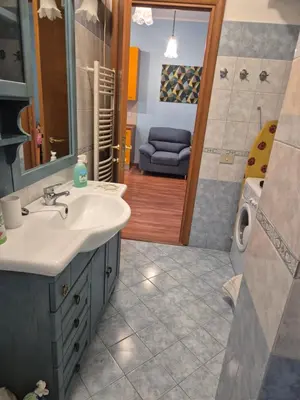 a bathroom with a sink and a shower at Olimpia Apartment in Rome