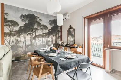 a dining room with a table and chairs at Dalia's Place in Rome