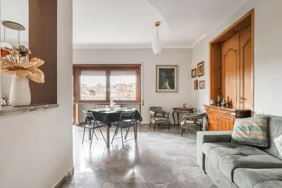 a living room with a bed and a wooden cabinet at Dalia's Place in Rome