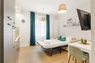 a living room with a couch and a table at AlbaDea Apartment in Rome