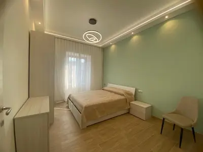 a bedroom with a bed and a chair in it at Claire House in Rome