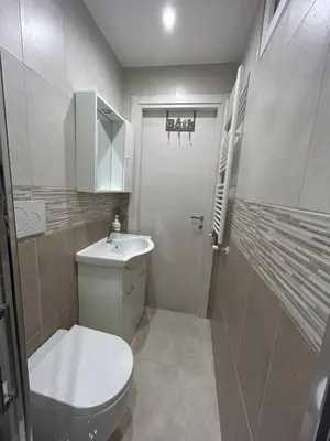 a small bathroom with a toilet and a sink at Claire House in Rome