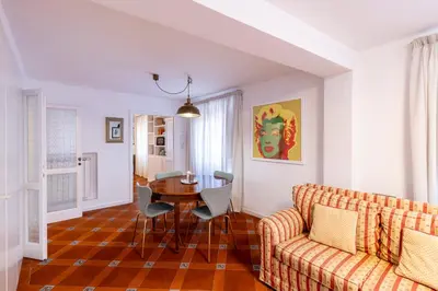 a living room with a couch and a table at Parlamento Luxury Apartment in Rome