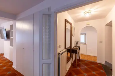 a hallway with a door leading into a room at Parlamento Luxury Apartment in Rome