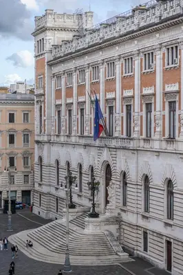 a large building with stairs in front of it at Parlamento Luxury Apartment in Rome