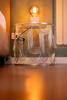 a glass table with a light on top of it at Parlamento Luxury Apartment in Rome