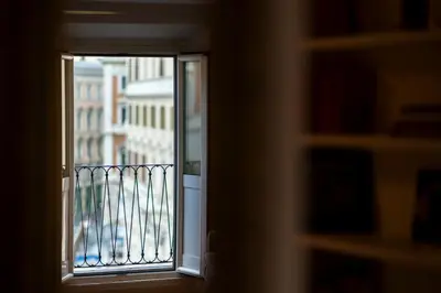 a window with a view of a balcony at Parlamento Luxury Apartment in Rome