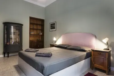 a bedroom with a bed with two towels on it at Angelico Vatican Apartment by Oneup Hospitality in Rome