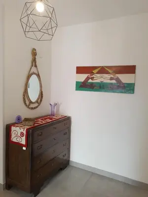 a bedroom with a dresser and a mirror at Urban cosy rooms in Rome