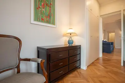 a room with a dresser with a lamp on it at Top View Luxury apartment Piazza del Popolo in Rome