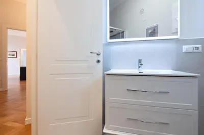 a bathroom with a white sink and a mirror at Top View Luxury apartment Piazza del Popolo in Rome