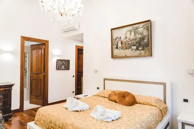 a bedroom with a bed with two pillows on it at Domus trastevere 900 in Rome