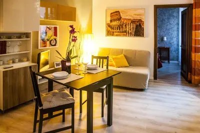 a living room with a table and a couch at Casa Federico - beauty apartment with wonderful terrace in Rome