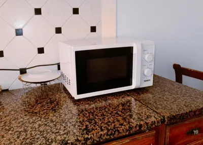a microwave oven sitting on top of a counter at Minerva Rooms in Rome