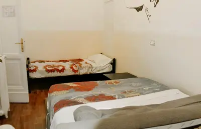 a small room with two beds in it at Minerva Rooms in Rome