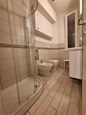 a bathroom with a shower and a toilet and a sink at Casa Vidaschi in Rome